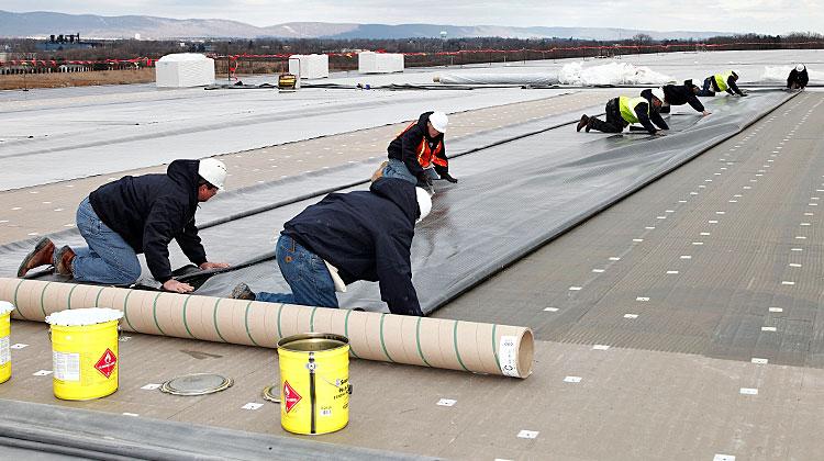 Commercial roof installation showing professional roofing work in progress